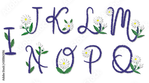 Embroidered letters of the Latin alphabet decorated with daisies.