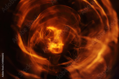 abstract light waves on a dark background. funnel of fire