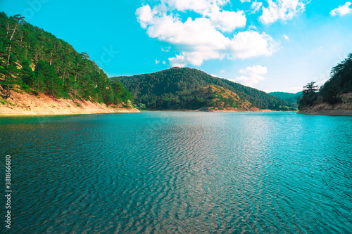 Sunnet Lake, Clean Wavy Water and blue sky, Mountain Forests at the far end, Bolu, Turkey