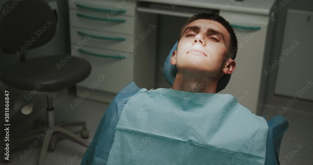 Couple of orthodontists with assistant. Using professional medical supplies for teeth correction treatment. Dentistry. Surgical operation. Doctors. Braces. Couple of orthodontists with assistant. Using professional medical supplies for teeth correction treatment. Dentistry. Surgical operation. Doctors. Braces.