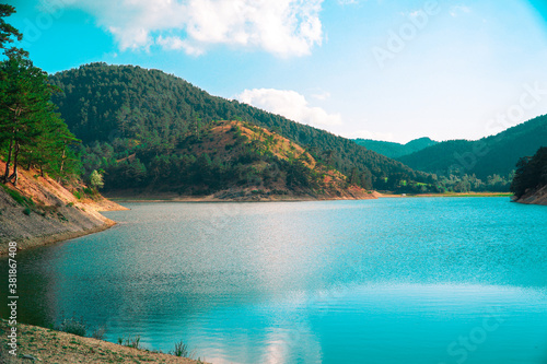 Sunnet Lake, clean water and blueish sky, Green Mountain Forests at the far end, Bolu, Turkey