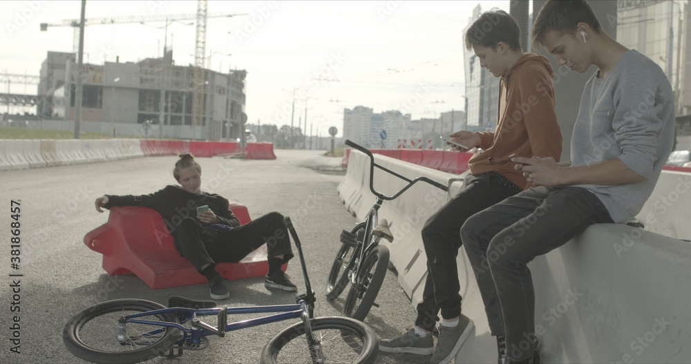 Tired bored friends with bikes Tired bored friends with bikes