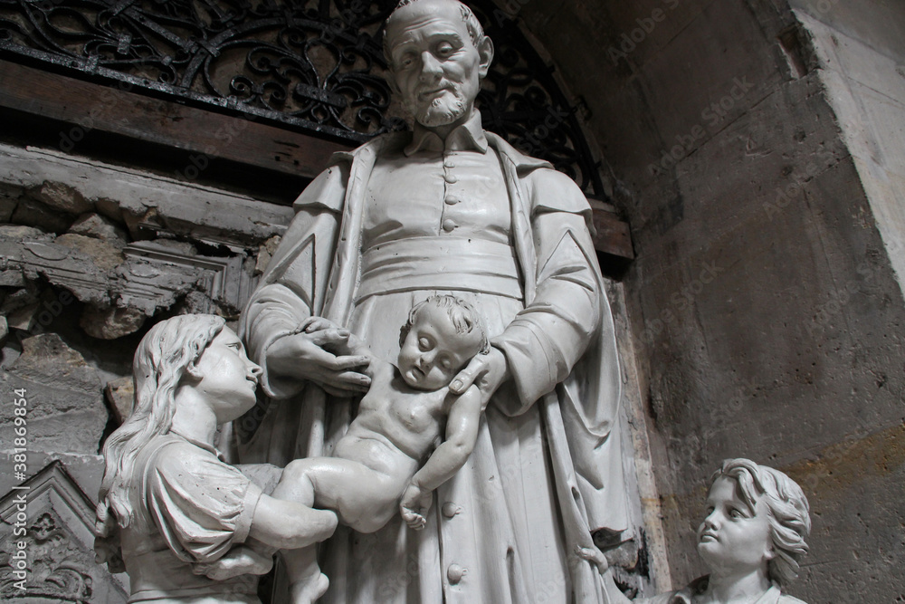 statue of a holy character in the saint-paul-saint-louis church in paris (france)