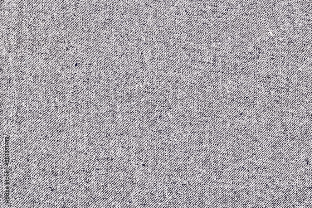 Fototapeta premium Texture of coarse fabric, burlap, light color. Drapery background. Grey denim fabric.