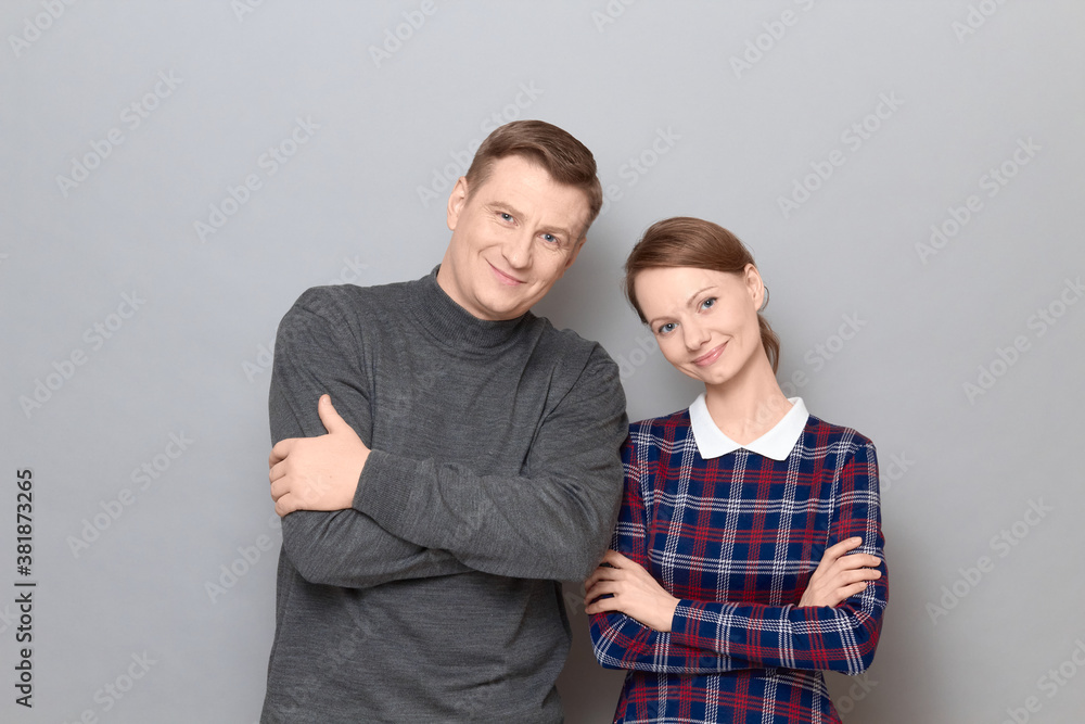 Portrait of happy joyful man and woman standing together and smiling Portrait of happy joyful man and woman standing together and smiling