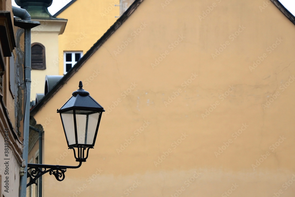 Vintage street lamp on a historic building in central zagreb, Croatia. Selective focus.