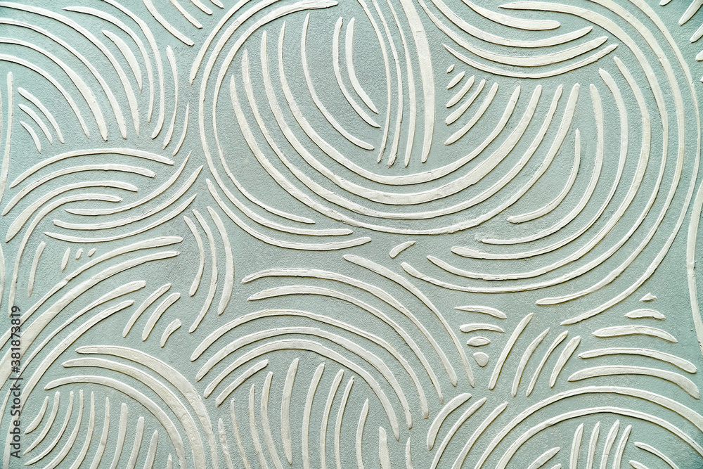 Decorative relief plaster with a unique pattern on wall