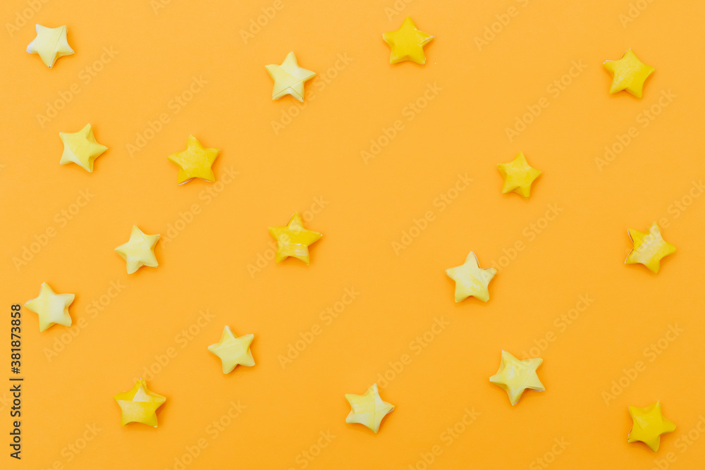 Solid yellow background with paper stars in a children's style. Template for scrapbooking. Solid yellow background with paper stars in a children's style. Template for scrapbooking.