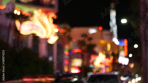 Defocused fabulous Las Vegas Strip boulevard, luxury casino and hotel, gambling area in Nevada, USA. Nightlife and traffic near Fremont street in tourist money playing resort. Neon lights of sin city.