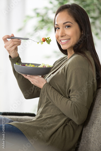close up portrait of woman eating salad