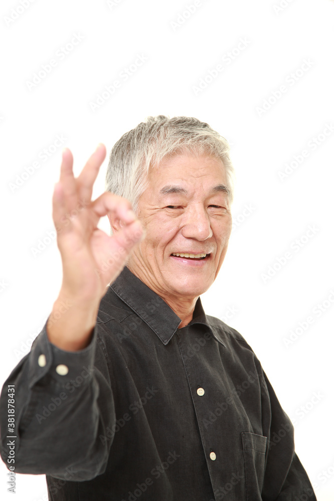senior Japanese man showing perfect sign senior Japanese man showing perfect sign