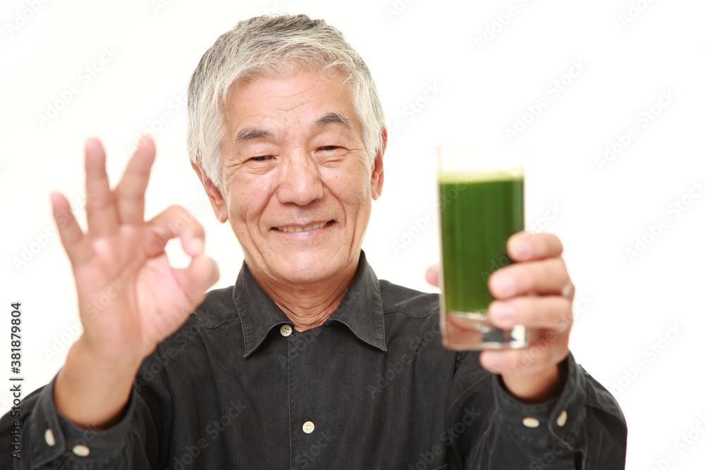 senior Japanese man with green vegetable juice senior Japanese man with green vegetable juice