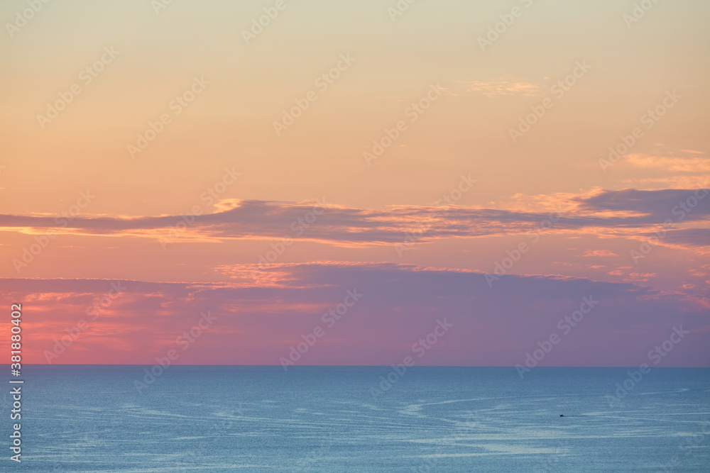 Lovely evening sky and panoramic view. Golden hour and calm sea. Virgin nature and ocean landscape concept, copy space