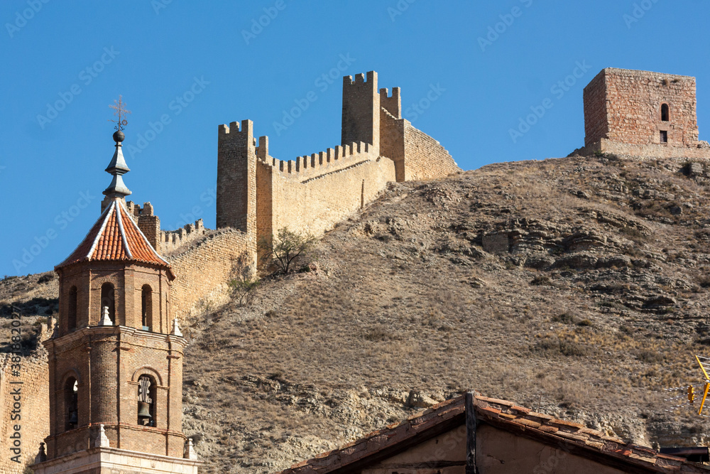 Castle and wall. Albarracín is a very famous town for being one of the most beautiful in Aragon, Spain. It is famous for its medieval castle