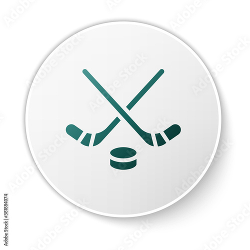 Green Ice hockey sticks and puck icon isolated on white background. Game start. White circle button. Vector.