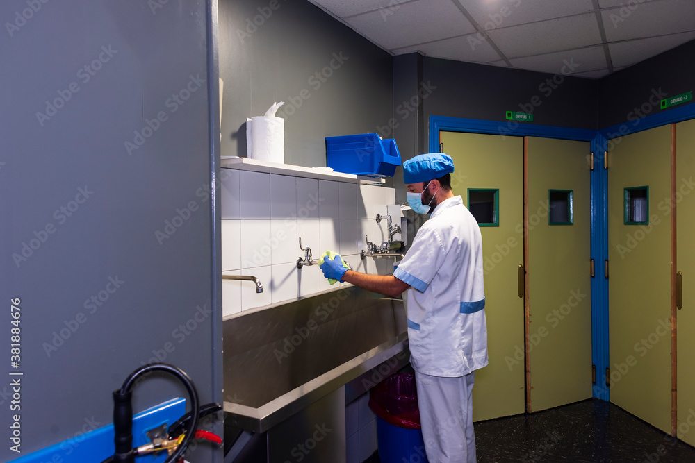 Naklejka premium cleaning staff performing disinfection and hygiene work in hospital facilities