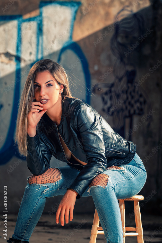 Model with leather jacket and blue jeans Model with leather jacket and blue jeans