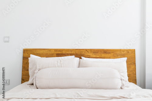 Closed up of white comfy pillow on the bed. Minimalist bedding and living space.