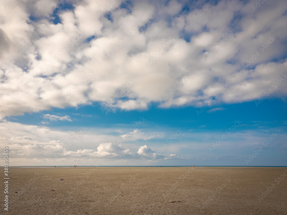 Dramatic cumulus cloudscape over Chapin Memorial Beach on Cape Cod at low tide