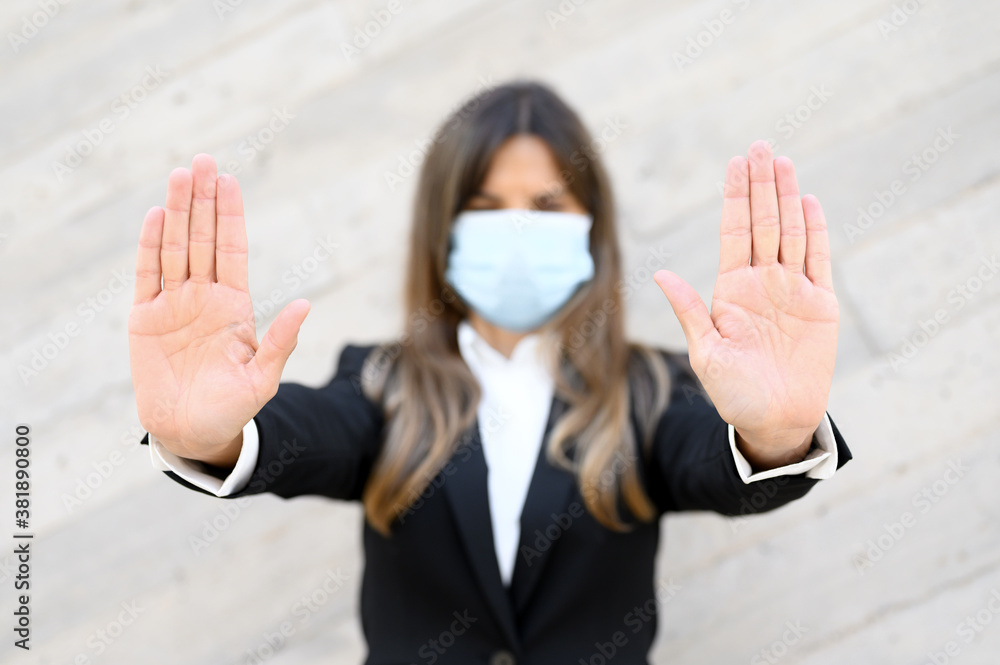 Coronavirus concept. Woman wearing mask for protection from disease, shows stop gesture with hands, for stop coronavirus outbreak. Global call to stay home. High quality photo. Coronavirus concept. Woman wearing mask for protection from disease, shows stop gesture with hands, for stop coronavirus outbreak. Global call to stay home. High quality photo.