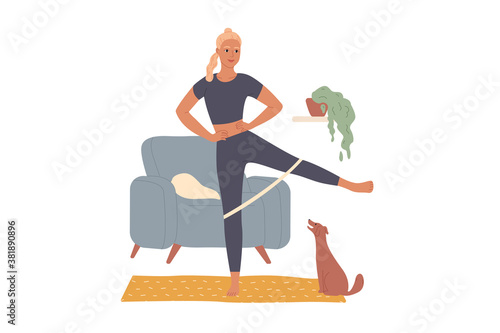 Woman trains at home, doing leg exercises overcoming the resistance of the rubber band