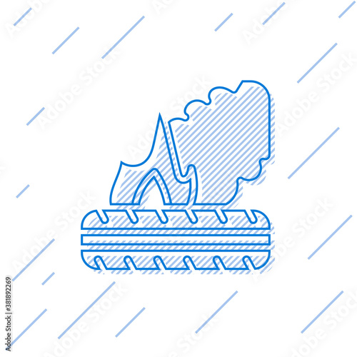 Blue line Lying burning tires icon isolated on white background. Vector.