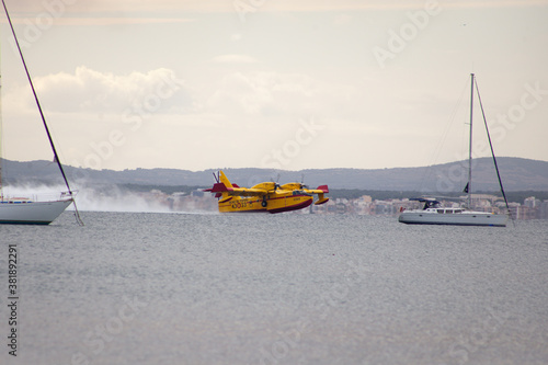 S'Albufera, Angry fire in S´Albufera in Mallorca, Balears, 26th September 2020, Alcudia, airplan under sea, the plane puts out the fire in Majorca, Spain,
the area between Muro and Can Picafort photo