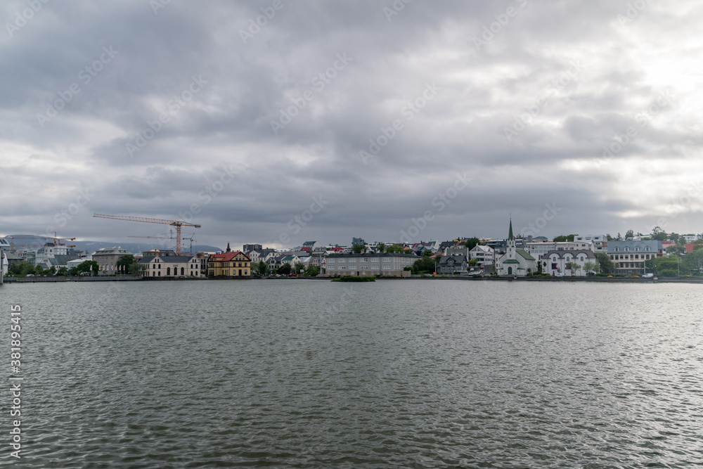 Cityscape of Reykjavik on lake Tjornin in Iceland.