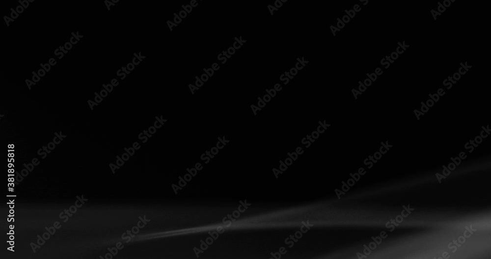 White smoke floating through space against black background White smoke floating through space against black background