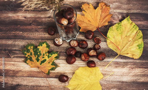 
Chestnuts on the table in different dishes. And there are leaves nearby.