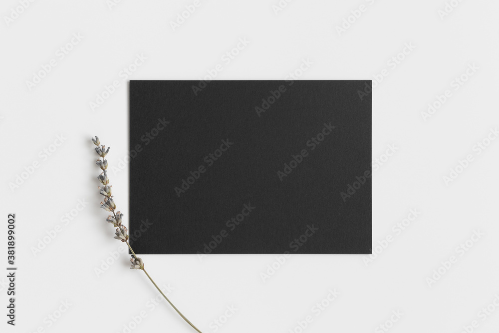 Black invitation card mockup with a lavender. 5x7 ratio, similar to A6, A5.