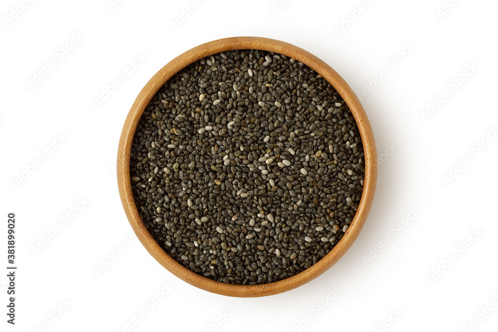 Chia seeds in wooden bowl on white background Chia seeds in wooden bowl on white background