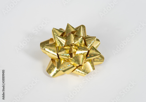 Shiny, festive gold bow for special occasion, including Wedding, Christmas, Anniversary, Birthday, on white background