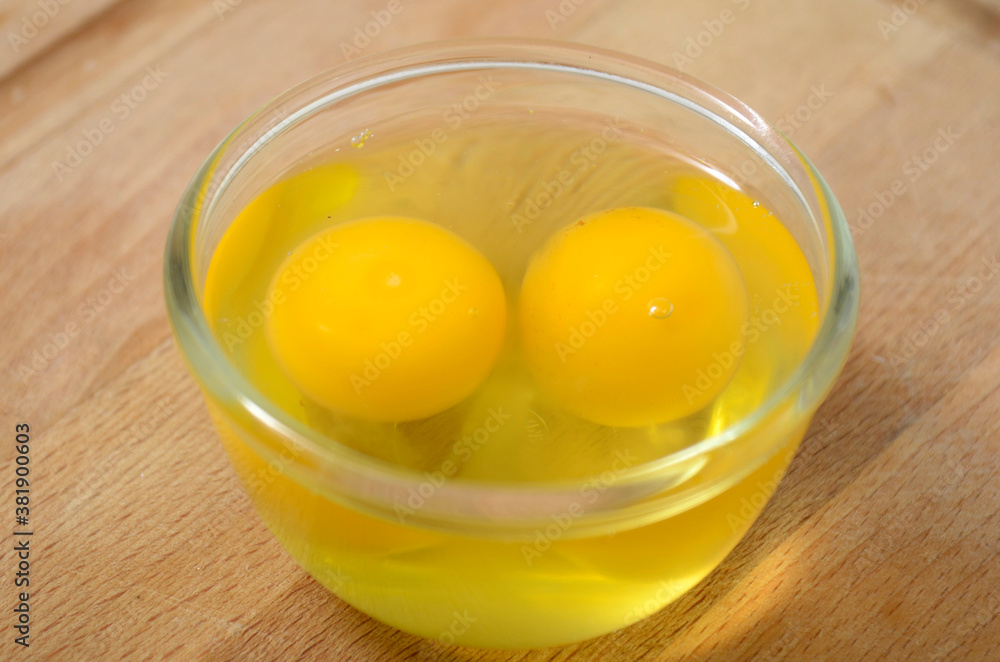 two eggs yolk in the glass bowl two eggs yolk in the glass bowl