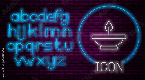 Glowing neon line Aroma lamp icon isolated on brick wall background. Neon light alphabet. Vector.