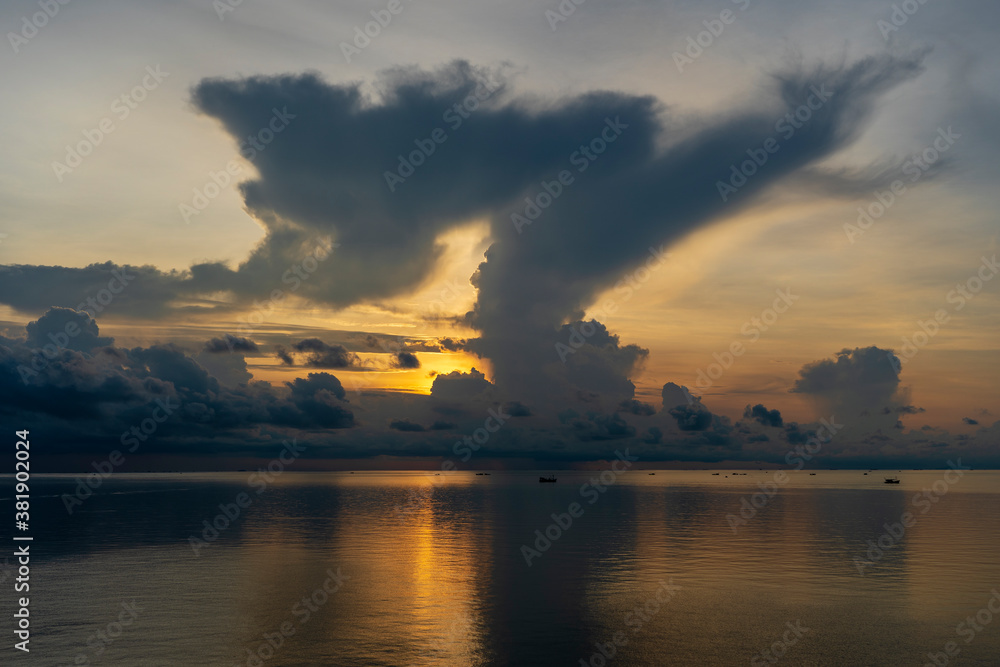 Sunrise on the island of Phu Quoc, Vietnam. Travel and nature concept. Morning sky, clouds, sun and sea water Sunrise on the island of Phu Quoc, Vietnam. Travel and nature concept. Morning sky, clouds, sun and sea water