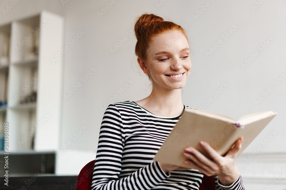 Attractive young woman reading paper book Attractive young woman reading paper book