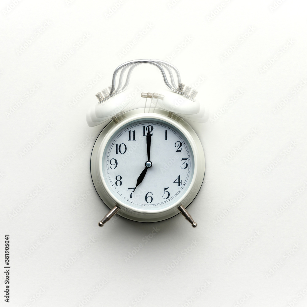 White alarm clock on white background, flat lay White alarm clock on white background, flat lay