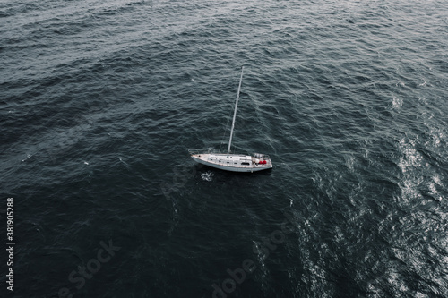 A Yacht Moored in Dark Seas