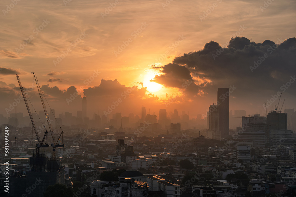Fototapeta premium Sunrise over Bangkok city with crowded building in downtown