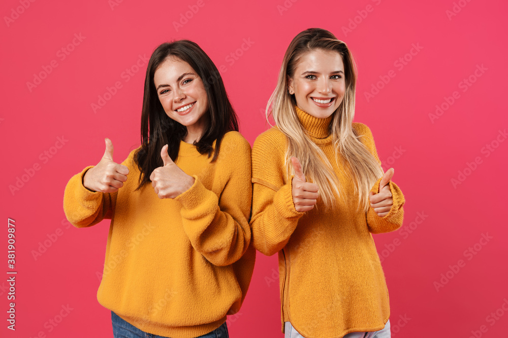 Image of smiling beautiful women showing thumbs up Image of smiling beautiful women showing thumbs up