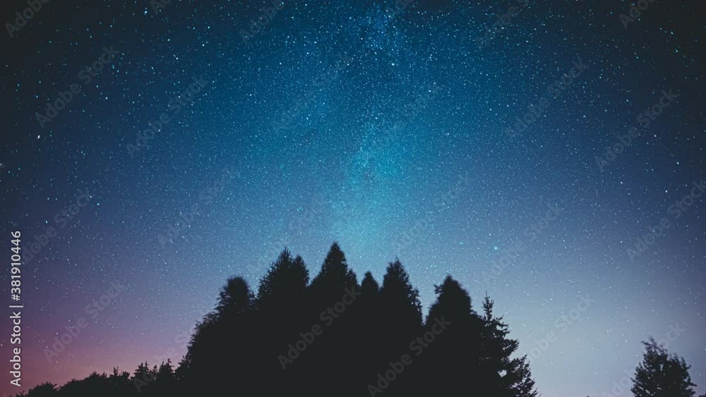 Wonderful Night sky with milky way rising above the forest pine trees and flying clouds. Wonderful Night sky with milky way rising above the forest pine trees and flying clouds.