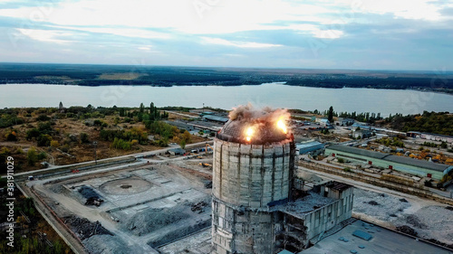 Quadro su tela Demolition of old industrial building by exploding dynamite, aerial view