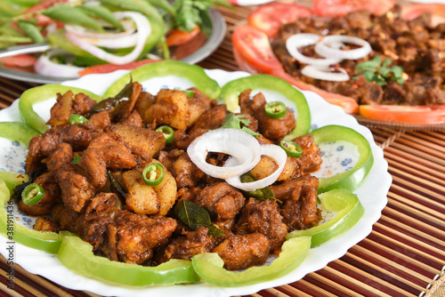 Fotografie Spicy hot meat curry from Kerala India