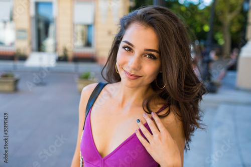 Lifestyle  portrait of happy  brunette woman  in stylish dress. Cheerful young girl having fun , enjoying  summer vacation and weekends.