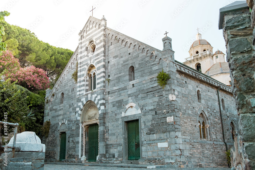 Porto venere church Sanctuary of the White Madonna frontal view in Liguria, Italy, at sunset. Example of christian romanic style architecture
