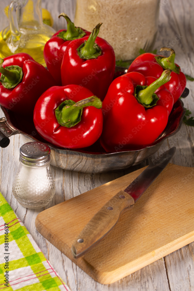 Fresh ripe red bell peppers on the kitchen table Fresh ripe red bell peppers on the kitchen table