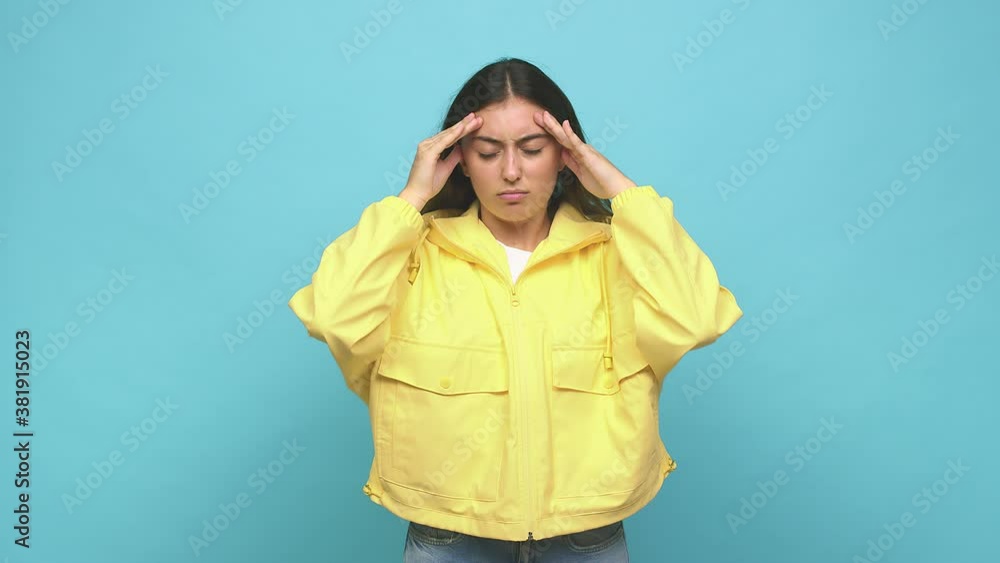 Young caucasian woman touching temples and having headache Young caucasian woman touching temples and having headache