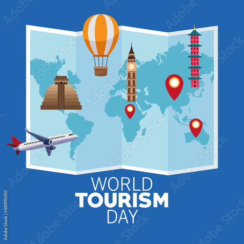 world tourism day lettering celebration with paper map and monuments