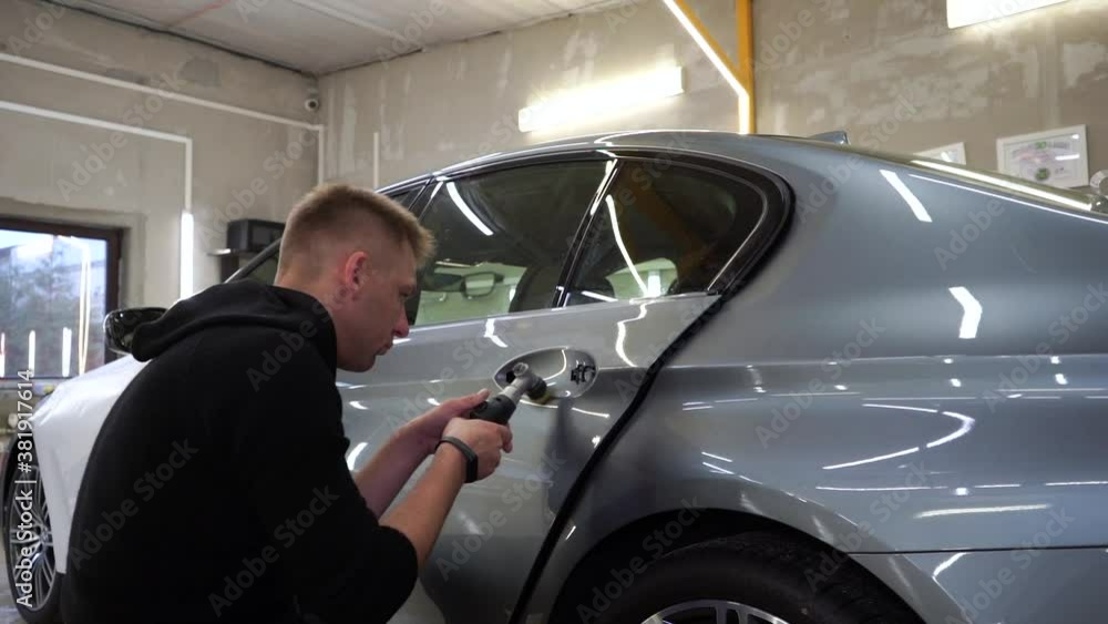 Polishes the car door, detailing slowmo Polishes the car door, detailing slowmo